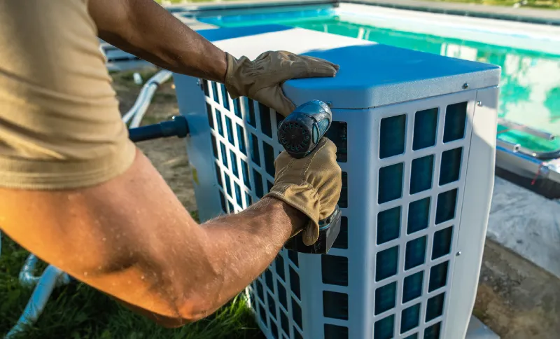 Technician repairing pool heater